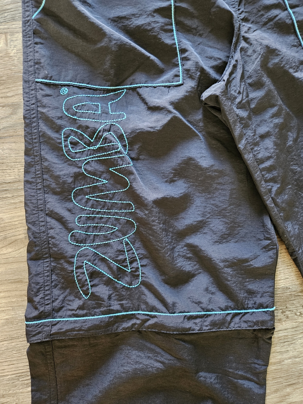 Zumba Fitness Men's Black Zip It Convertible Cargo Pants With Teal Embroidery - Picture 7 of 14